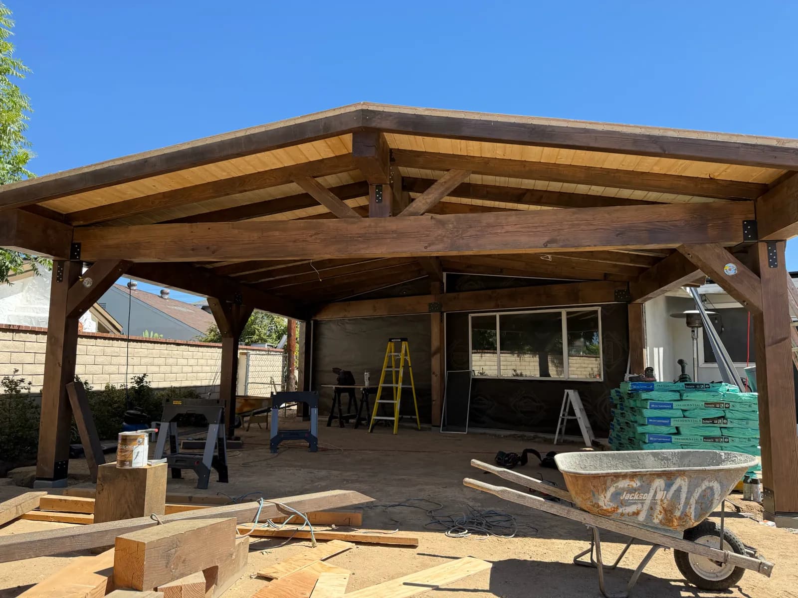 The same patio cover nearing completion with the wood ceiling installed.